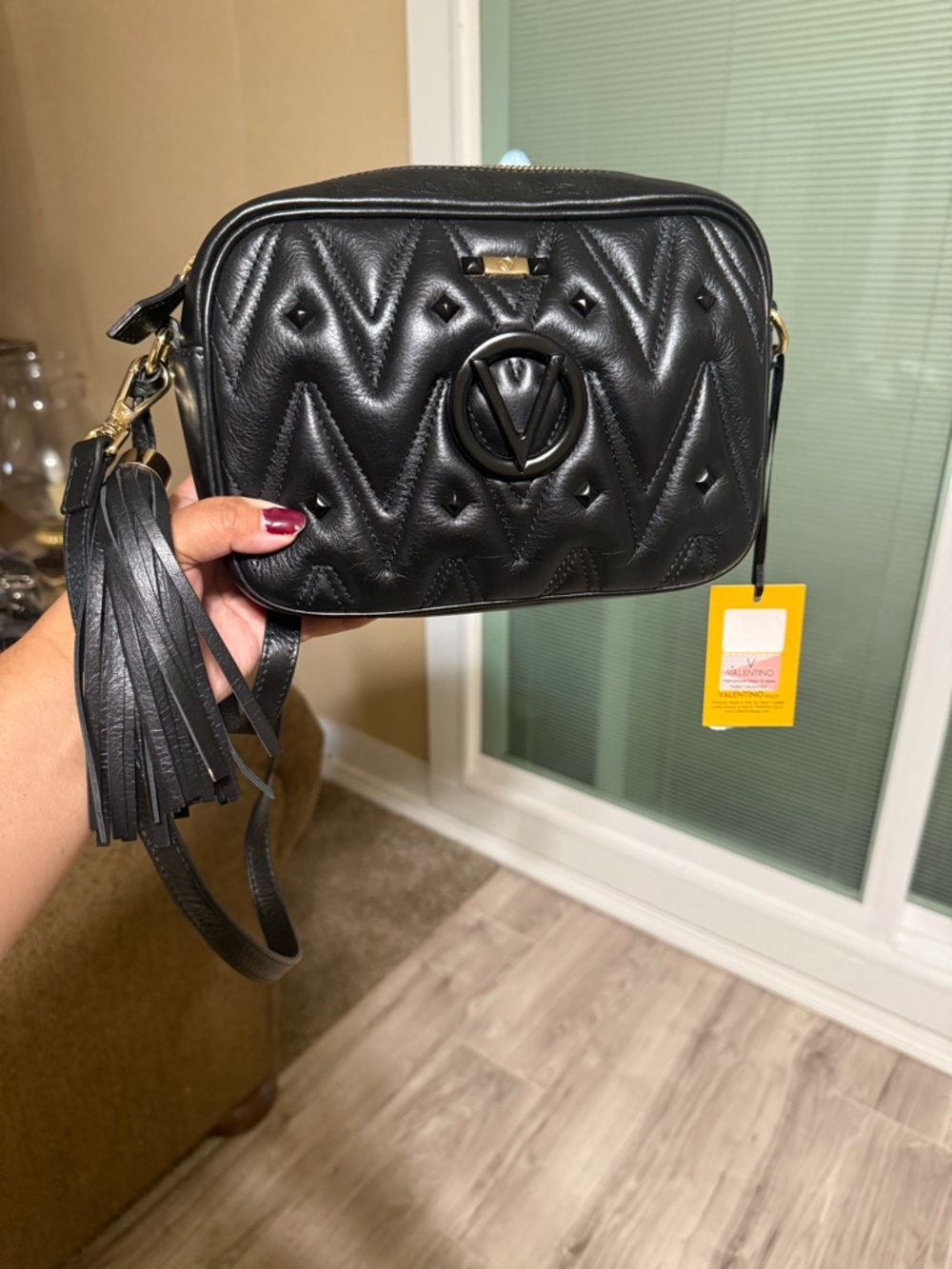 Valentino Black quilted crossbody bag with tassel detail